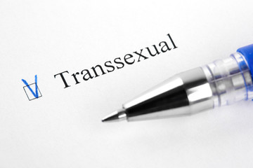 Transsexual. Filling in the questionnaire, documents. The checkboxes are filled with a black pen on a white background. Questionnaire, survey.