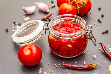 Tomato confiture, jam, chutney, sauce. Homemade preservation concept