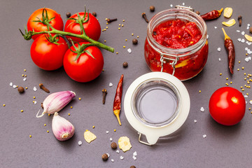Tomato confiture, jam, chutney, sauce. Homemade preservation concept