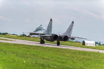 Fototapeta premium Russian fighter Mikoyan Gurevich MiG 29 heat up engines before flight