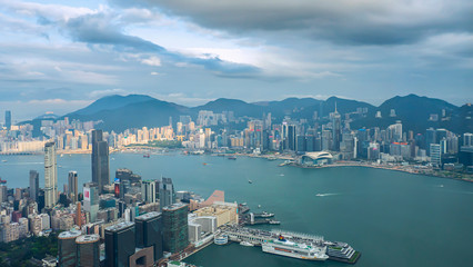 Fototapeta na wymiar High view of Hong Kong skyline cityscape over Victoria harbour in the afternoon
