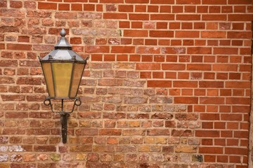 vintage street lamp on a brick wall