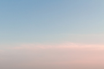 Beautiful sunset sky with feathery pink clouds in spring