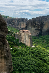 Secluded Greek monastery on top of rock cliff v8
