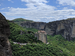 Fototapeta na wymiar Secluded Greek monastery on top of rock cliff