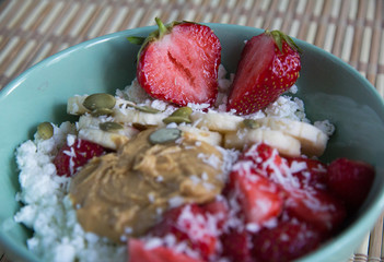 Cottage cheese with peanut butter, coconut, strawberries and bananas