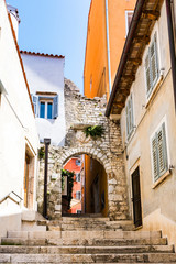 Fototapeta na wymiar gate with stairs to the old city of Rovinj, Croatia