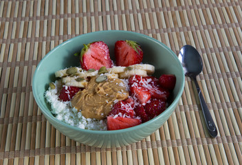 Cottage cheese with peanut butter, coconut, strawberries and bananas