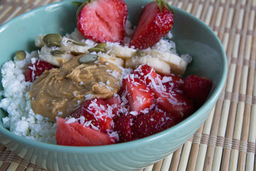 Cottage cheese with peanut butter, coconut, strawberries and bananas