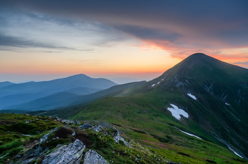 Misty sunset in Carpathian mountains viewing Hoverla and Petros