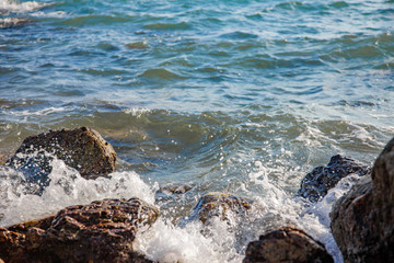splash water on rock beach summer scenic.