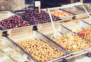 Green and black olives in the fruit market, Catania, Sicily, Italy.