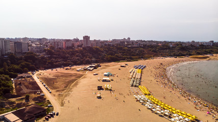 Aerial view of public beach in Constanta, popular tourist place and resort on black sea in a Romania. Also, in constanta is placed largest harbor in Romania.