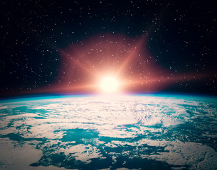 Obraz premium Sunflare and the earth from space. The elements of this image furnished by NASA.