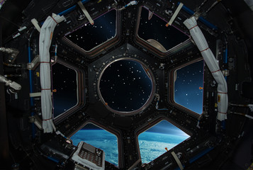 Fascinating sunrise on earth. Spaceship window view. Elements of this image furnished by NASA.