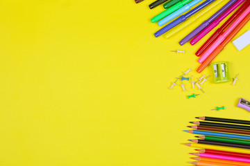 Different colorful School supplies on yellow background. Back to school sale, sopping concept