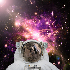 Obraz na płótnie Canvas Closeup of astronaut. Galaxy on the background. The elements of this image furnished by NASA.