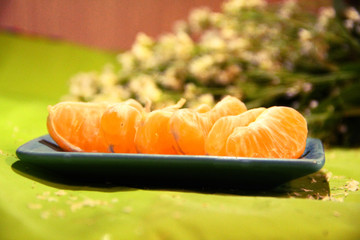 Still life: tangerines and flowers