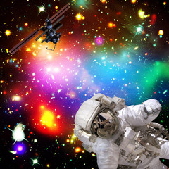 Astronaut flies in space. The elements of this image furnished by NASA.