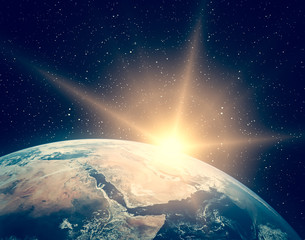 Planet earth and fascinating sunrise. The elements of this image furnished by NASA.