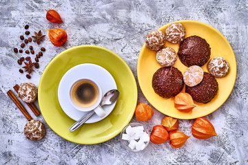 Coffee espresso with foam with sweets on a grunge grey background. Top view. Tasty breakfast