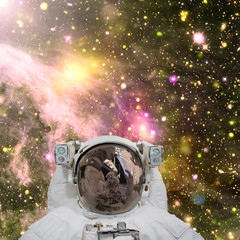 Obraz na płótnie Canvas Closeup of astronaut. Galaxy on the background. The elements of this image furnished by NASA.