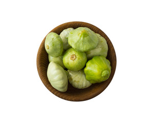 Fresh green squash isolated on a white background. Vegetable marrow in wooden bowl isolated on a white. Vegetables with copy space for text. Zucchini isolated on a white. Top view.