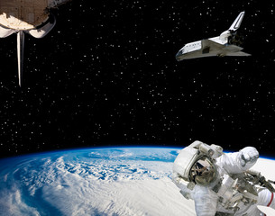 Astronaut and spaceships against earth. The elements of this image furnished by NASA.