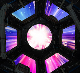 Hyper jump in in window of spaceship. Elements of this image furnished by NASA.