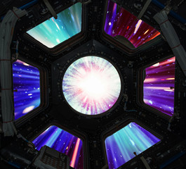 Hyper jump in in window of spaceship. Elements of this image furnished by NASA.