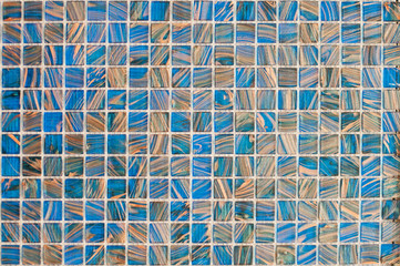 Beautiful glass mosaic for repair of elements with blue and yellow stripes