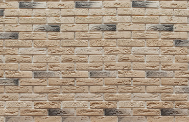 Background of masonry brown and beige clinker bricks on the wall, which are used in the repair of premises