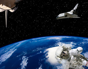 Astronaut and spaceships against earth. The elements of this image furnished by NASA.
