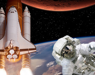 Rocket flies from earth to Mars. Astronaut in outer space. The elements of this image furnished by NASA.
