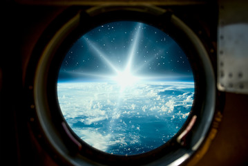 Fototapeta premium Sunrise, view from spaceship. Elements of this image furnished by NASA.