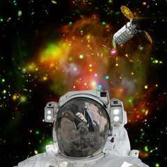 Astronaut posing against galaxies and stars. Outer space. The elements of this image furnished by...