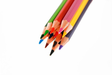 colorful wooden pencils for drawing on white background