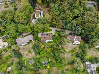 Fototapeta na wymiar Aerial view of country side area in Walloon Brabant, Belgium, Luxury villas with garden surrounded by forest during autumn season