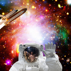 Fototapeta na wymiar Astronaut posing. Rocket on the backdrop. The elements of this image furnished by NASA.