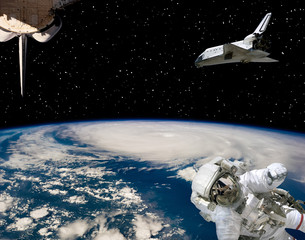 Astronaut and spaceships against earth. The elements of this image furnished by NASA.