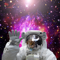 Fototapeta na wymiar Astronaut waves. The elements of this image furnished by NASA.