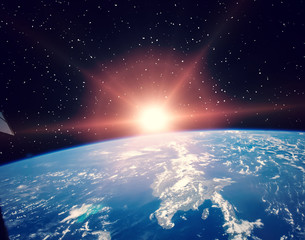 Obraz premium Sunflare and the earth from space. The elements of this image furnished by NASA.