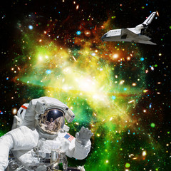 Obraz na płótnie Canvas Astronaut in outer space. Shuttle on the backdrop. The elements of this image furnished by NASA.