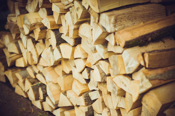 Barbecue firewood. Dry wooden sticks are stacked in a stack.Barbecue firewood. Dry wooden sticks are stacked in a stack.