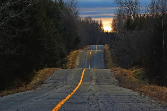 Sunset light on bumpy country road