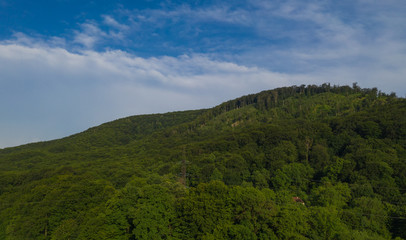 Mountain during sunrise / sunset. Natural summer landscape. Colorful summer landscape in the Carpathian mountains. Zakarpattia, Mukachevo region, Ukraine.