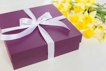 gift, purple box with white ribbon and yellow flowers