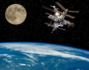 Moon and space station flying near. The elements of this image furnished by NASA.