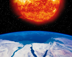 Earth planet and burning sun above it. The elements of this image furnished by NASA.