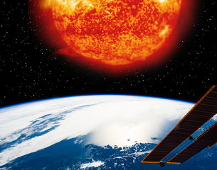 Earth planet and burning sun above it. The elements of this image furnished by NASA.